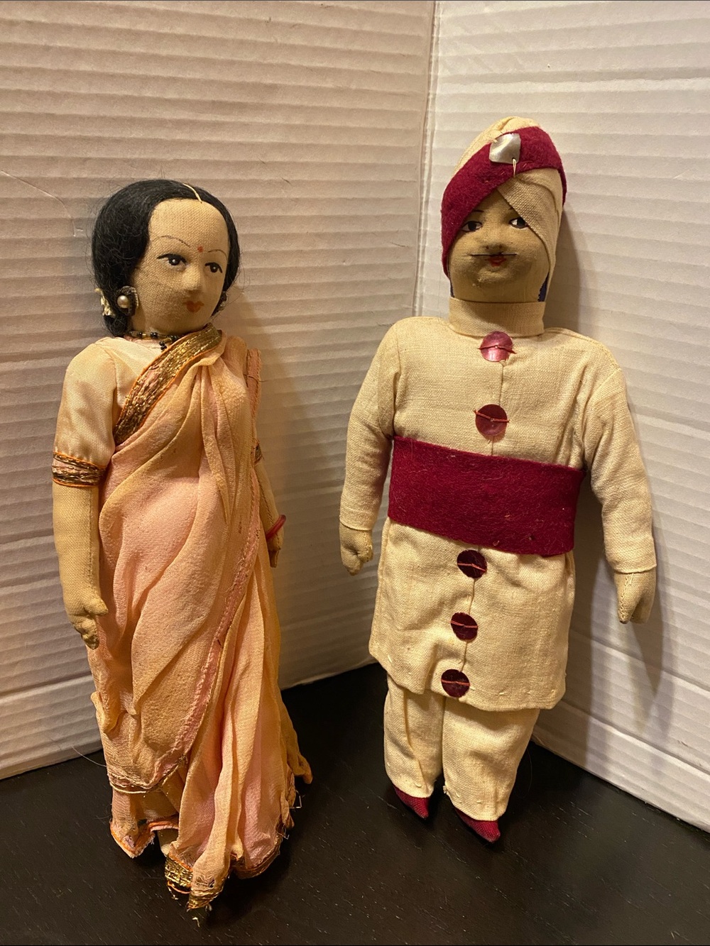 image shows a pair of vintage handmade Indian dolls.
